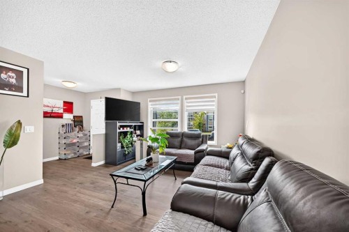 1108 Cornerstone Street Ne, Calgary, AB - Indoor Photo Showing Living Room With Fireplace