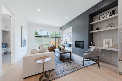 2302 Osborne Crescent Sw, Calgary, AB - Indoor Photo Showing Living Room With Fireplace