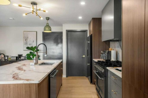 2316 State Road Sw, Calgary, AB - Indoor Photo Showing Kitchen With Stainless Steel Kitchen With Double Sink With Upgraded Kitchen