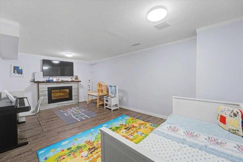114-210 86 Avenue Se, Calgary, AB - Indoor Photo Showing Living Room With Fireplace