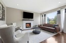79 Nolanfield Court Nw, Calgary, AB  - Indoor Photo Showing Living Room With Fireplace 