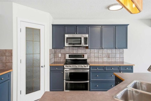 235 Arbour Stone Place Nw, Calgary, AB - Indoor Photo Showing Kitchen With Double Sink