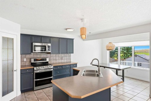 235 Arbour Stone Place Nw, Calgary, AB - Indoor Photo Showing Kitchen With Double Sink