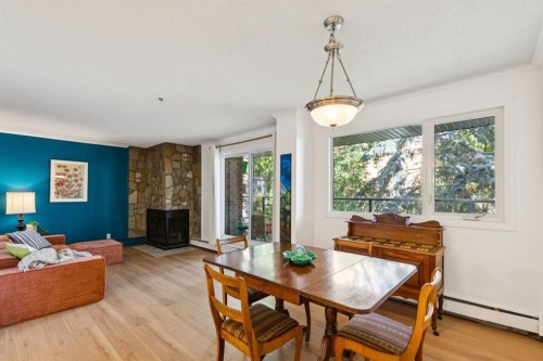 404-354 2 Avenue Ne, Calgary, AB - Indoor Photo Showing Other Room With Fireplace