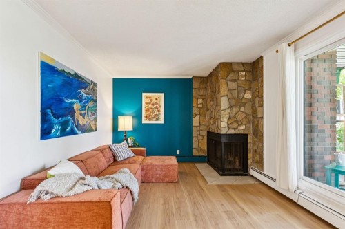 404-354 2 Avenue Ne, Calgary, AB - Indoor Photo Showing Living Room With Fireplace