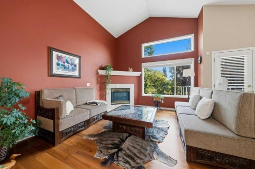 165 Douglasview Rise Se, Calgary, AB - Indoor Photo Showing Living Room With Fireplace
