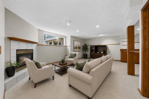 165 Douglasview Rise Se, Calgary, AB - Indoor Photo Showing Living Room With Fireplace
