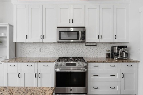 708 Coopers Square Sw, Airdrie, AB - Indoor Photo Showing Kitchen