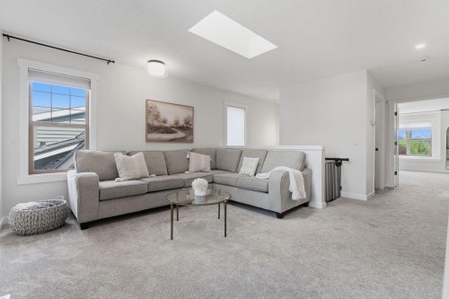 708 Coopers Square Sw, Airdrie, AB - Indoor Photo Showing Living Room