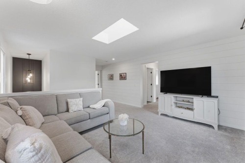 708 Coopers Square Sw, Airdrie, AB - Indoor Photo Showing Living Room