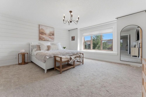 708 Coopers Square Sw, Airdrie, AB - Indoor Photo Showing Bedroom