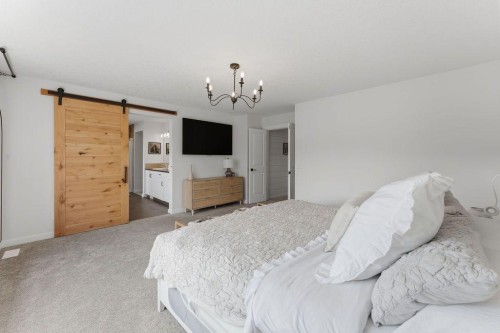 708 Coopers Square Sw, Airdrie, AB - Indoor Photo Showing Bedroom