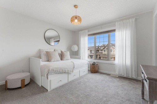 708 Coopers Square Sw, Airdrie, AB - Indoor Photo Showing Bedroom