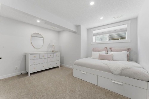 708 Coopers Square Sw, Airdrie, AB - Indoor Photo Showing Bedroom