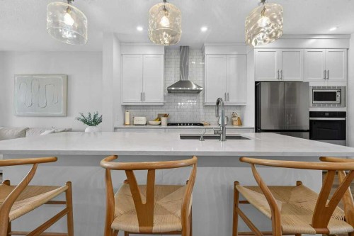 97 Rowmont Heath Nw, Calgary, AB - Indoor Photo Showing Kitchen With Upgraded Kitchen