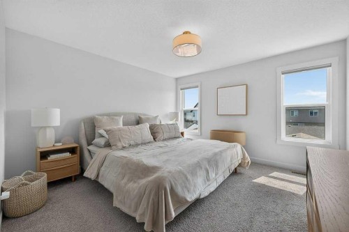 97 Rowmont Heath Nw, Calgary, AB - Indoor Photo Showing Bedroom