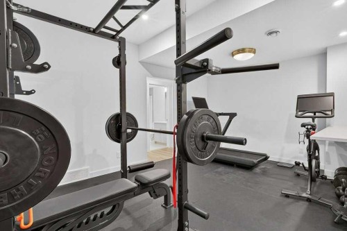 97 Rowmont Heath Nw, Calgary, AB - Indoor Photo Showing Gym Room