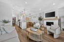 97 Rowmont Heath Nw, Calgary, AB  - Indoor Photo Showing Living Room With Fireplace 
