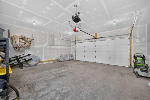97 Rowmont Heath Nw, Calgary, AB - Indoor Photo Showing Garage