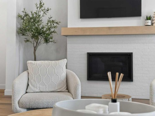 97 Rowmont Heath Nw, Calgary, AB - Indoor Photo Showing Living Room With Fireplace