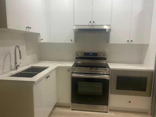 113 Corner Glen Way Ne, Calgary, AB - Indoor Photo Showing Kitchen With Double Sink