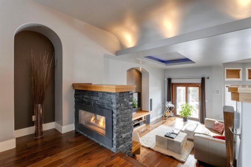 2217 8 Avenue Se, Calgary, AB - Indoor Photo Showing Living Room With Fireplace
