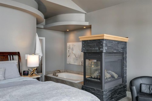 2217 8 Avenue Se, Calgary, AB - Indoor Photo Showing Bedroom With Fireplace