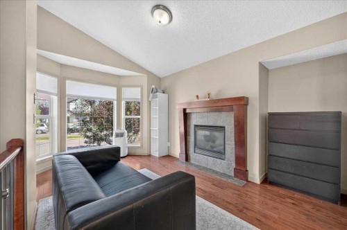 139 Silverado Way Sw, Calgary, AB - Indoor Photo Showing Living Room With Fireplace