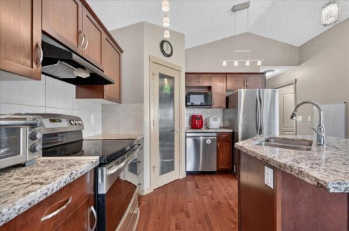 139 Silverado Way Sw, Calgary, AB - Indoor Photo Showing Kitchen With Double Sink With Upgraded Kitchen