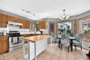228 Arbour Ridge Way Nw, Calgary, AB  - Indoor Photo Showing Kitchen With Double Sink 