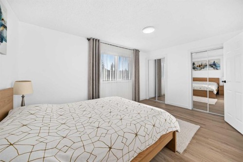 135 Woodsman Lane Sw, Calgary, AB - Indoor Photo Showing Bedroom