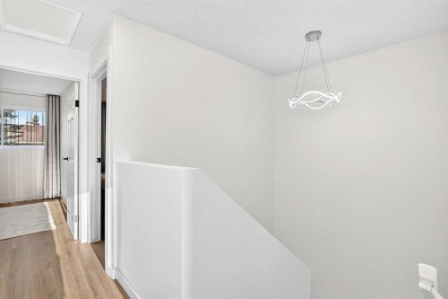 135 Woodsman Lane Sw, Calgary, AB - Indoor Photo Showing Other Room