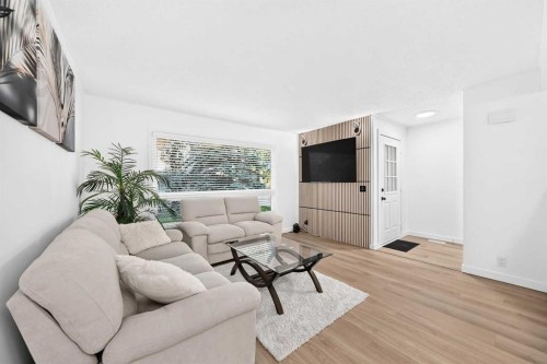 135 Woodsman Lane Sw, Calgary, AB - Indoor Photo Showing Living Room