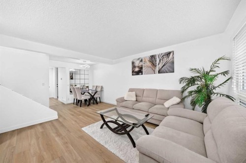 135 Woodsman Lane Sw, Calgary, AB - Indoor Photo Showing Living Room