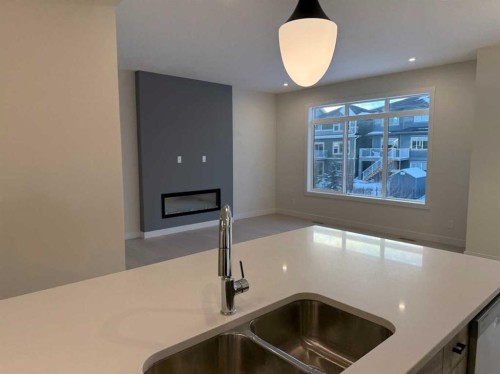 111 Sundown Crescent, Cochrane, AB - Indoor Photo Showing Kitchen With Double Sink