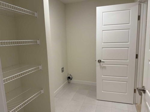 111 Sundown Crescent, Cochrane, AB - Indoor With Storage