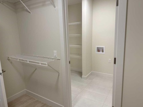 111 Sundown Crescent, Cochrane, AB - Indoor With Storage