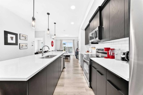 2308-220 Seton Grove Se, Calgary, AB - Indoor Photo Showing Kitchen With Double Sink With Upgraded Kitchen