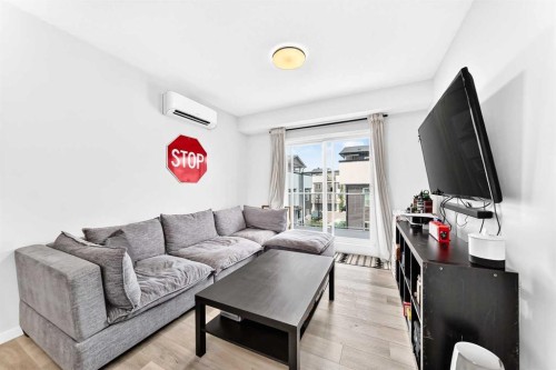2308-220 Seton Grove Se, Calgary, AB - Indoor Photo Showing Living Room