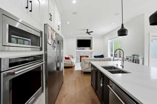 166 Kinniburgh Crescent, Chestermere, AB - Indoor Photo Showing Kitchen With Stainless Steel Kitchen With Double Sink With Upgraded Kitchen