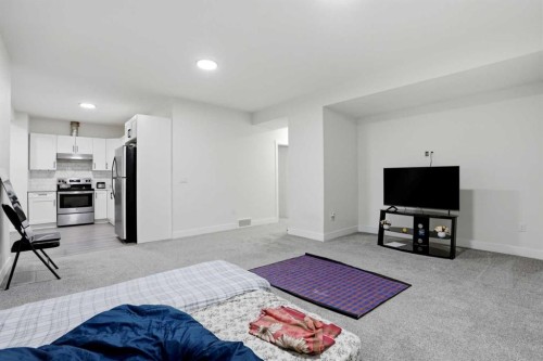 166 Kinniburgh Crescent, Chestermere, AB - Indoor Photo Showing Living Room