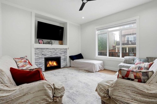 166 Kinniburgh Crescent, Chestermere, AB - Indoor Photo Showing Living Room With Fireplace