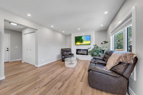 44 Harvest Oak Way Ne, Calgary, AB - Indoor Photo Showing Living Room With Fireplace