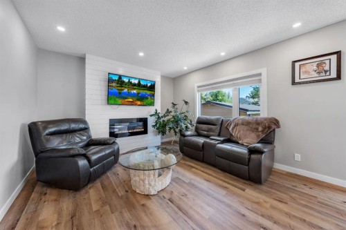 44 Harvest Oak Way Ne, Calgary, AB - Indoor Photo Showing Living Room With Fireplace