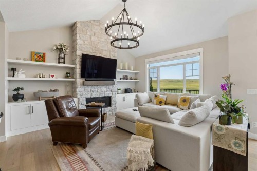 13 Sunvalley View, Cochrane, AB - Indoor Photo Showing Living Room With Fireplace