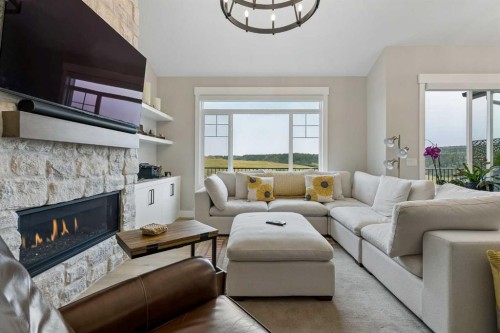 13 Sunvalley View, Cochrane, AB - Indoor Photo Showing Living Room With Fireplace