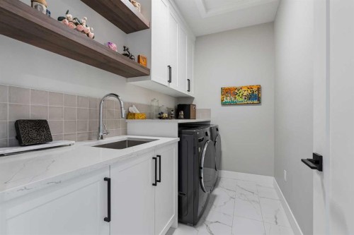 13 Sunvalley View, Cochrane, AB - Indoor Photo Showing Laundry Room