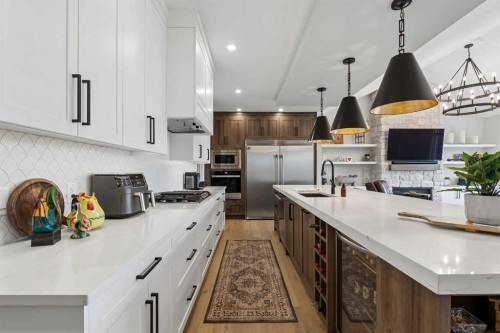 13 Sunvalley View, Cochrane, AB - Indoor Photo Showing Kitchen With Upgraded Kitchen