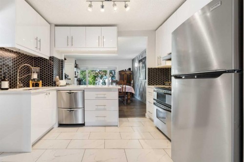 809 68 Avenue Sw, Calgary, AB - Indoor Photo Showing Kitchen With Stainless Steel Kitchen