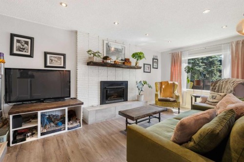 809 68 Avenue Sw, Calgary, AB - Indoor Photo Showing Living Room With Fireplace